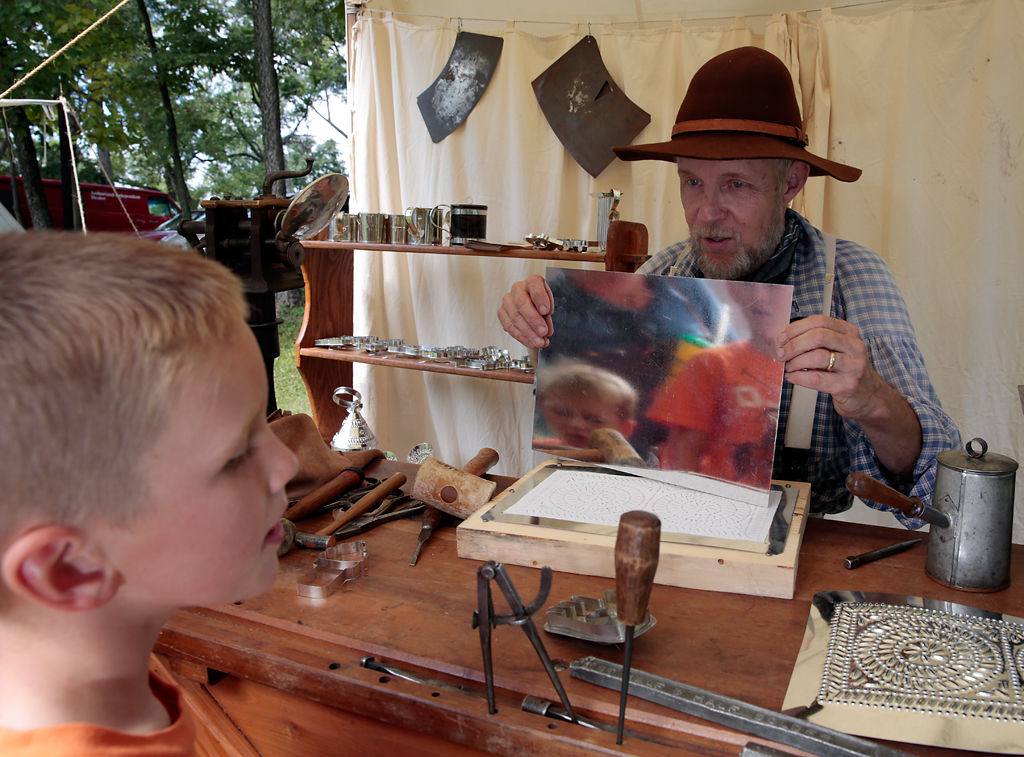 Rigg Smith and Wyatt Smith are reflected in a tin metal